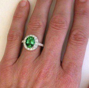 Green garnet with white diamonds, set in white gold.